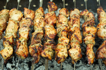 Meat skewers on grill as background, closeup. Outdoor kitchen