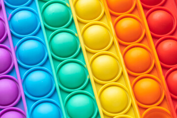 Close-up of a pop-it toy. Colorful background and copy space.
