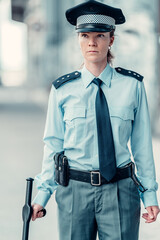 young woman female police officer on duty