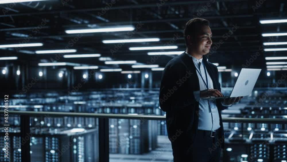 Aufkleber Portrait of IT Specialist Uses Laptop in Data Center. Server Farm Cloud Computing Facility with Male System Administrator Working. Cyber Security and Network Protection. Wide Medium Static Shot