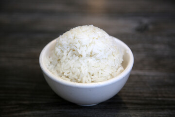 White steamed rice in a dish. Chinese Steamed Wite Rice in a white bowl. Chinese Lunch. White Rice.