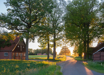 old barns and farm at sunset in rural area of twente near oldenzaal in holland