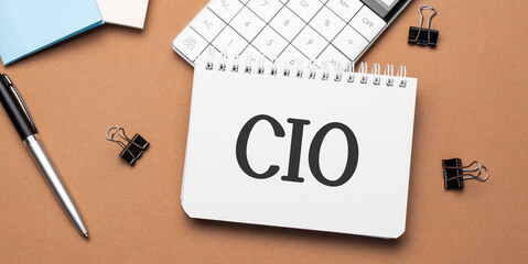 cio on notepad with pen, glasses and calculator - obrazy, fototapety, plakaty