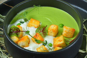 Broccoli cream soup and ingredients on table