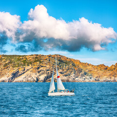 Splendid view of sailboat sailing near the cliffs of  Santa Teresa Gallura