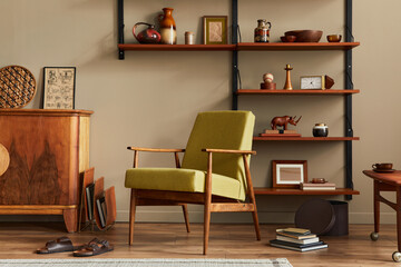 Stylish composition of retro living room interior with design armchair, wooden bookcase, coffee table, picture frames, plant, carpet, slippers, decoration and elegant accessories in home decor. 