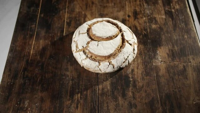 Tilt down shot of loaf of bread with number 9 on it