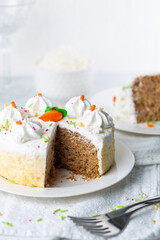Carrot cake with icing and sprinkles at an Easter party