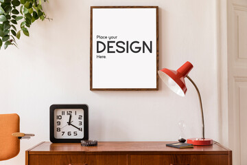 Minimalistic and stylish mock up poster frame concept with retro furnitures, hanging plant, table lamp, decoration and elegant accessories. White walls. Template.