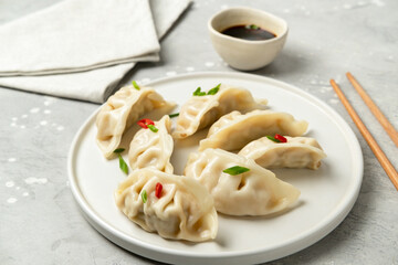 Take out food. Gyoza dumplings with soy sauce. 