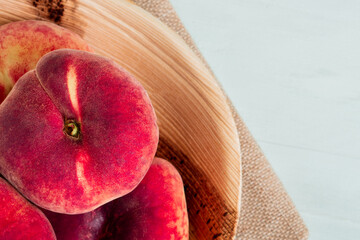 Fresh natural organic bio fruit red rip sweet juicy flat peaches for blossom spring summer peach...