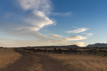 Fototapeta na wymiar sunset over a dry mountains landscape