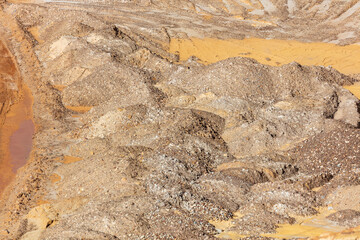 Photograph of crushed sand and stone in a large quarry
