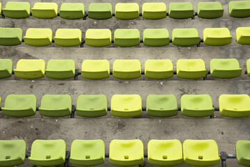 Rows of green seats in an olympic stadium