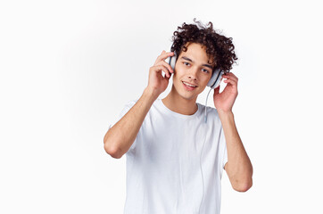 Cheerful Guy in headphones listens to music emotions joy cropped view
