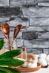 Zero waste concept. Natural biodegradable kitchen utensils on a gray stone background.