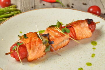 Delicious roasted grilled salmon on skewers top view