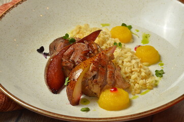 Meat steak with garnish on white plate closeup with coock ingredients