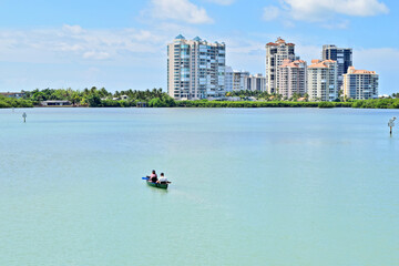 Kayaking in a Lake with Condominums in the Background