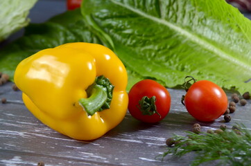 Fresh yellow pepper and cherry tomatoes closeup food background
