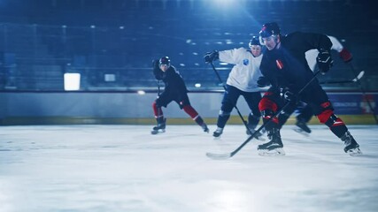 Ice Hockey Rink Arena: Professional Forward Player Breaks Defense, Hitting Puck with Stick Scores Goal, Goalie Missed it. Two Competitive Teams Play. Cinematic Slow Motion Tracking Wide Profile - Powered by Adobe