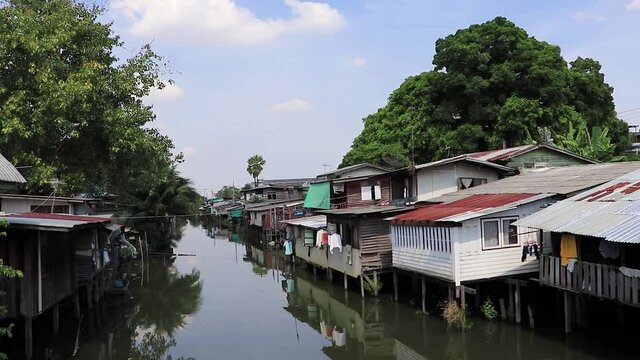 Life along Prem Prachakon canal river Don Mueang Bangkok Thailand.