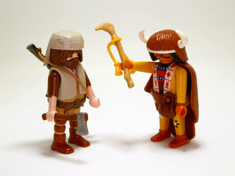 Playmobil doll. American Indian chief. Redskin.  Highlander. Mountain man. Hunter. Woodcutter. Collectible children's toy. Native American.  Wild West. Toys for kids. Toys for play. Isolated white. 