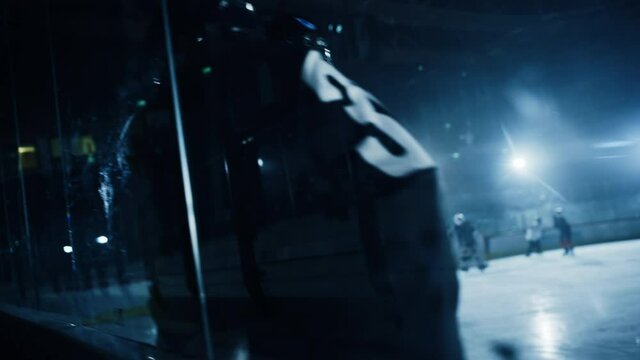 Ice Hockey Rink Arena: Professional Defender Player Attacks, Boarding Attacker Aggressively, Taking away the Puck. Competitive Intense Game with Amazing Skills, Speed, Energy, Power. Slow Motion