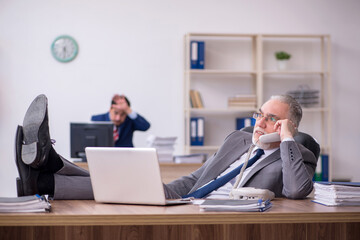 Two male employees working in the office