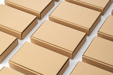 Neatly arrange the cardboard boxes on a white background. - obrazy, fototapety, plakaty