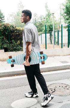 Man holding a skateboard
