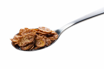 Chocolate cornflakes on a spoon isolated in white
