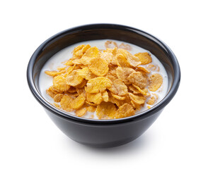 Milk and cornflakes in a black bowl