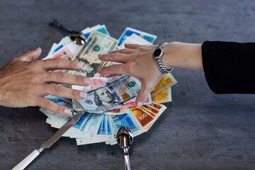 Plate with New Israeli shekels bills. hand of man and wad of cash on white plate on the table....