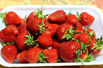 Ripe delicious juicy strawberries are shot close-up and are a source of vitamins.