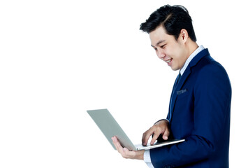 Young attractive asian business man wearing navy blue suit with white shirt and necktie holding and using his laptop on white background isolated