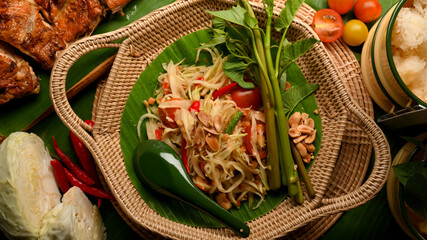 Thai traditional food, Somtum or papaya salad with grilled chicken, sticky rice and vegetables