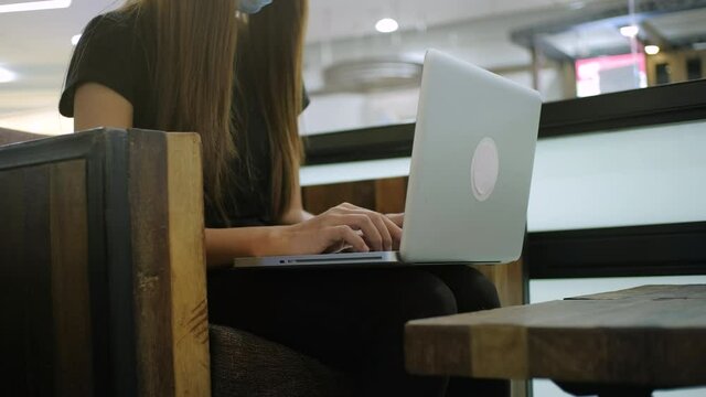 Female hands of businesswoman professional user worker using typing on laptop notebook keyboard sit at coffee shop working online with pc software apps technology concept, close up