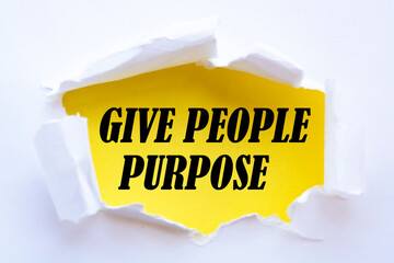 GIVE PEOPLE PURPOSE message written under torn paper.