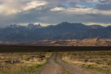 A Desert Valley Landscape with Mountains and Sand dunes in Colorado