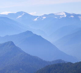 Mountain peaks in the morning haze, summer