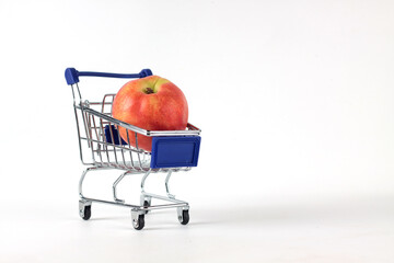 juicy nectarine in a shopping cart isolated on white background