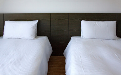 Two single beds side by side in the room.