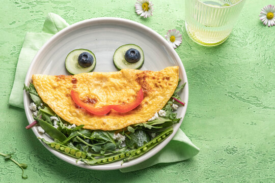 Breakfast for kids - frog omelet with vegetables