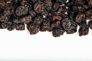 Dried grapes on white background. Top view.