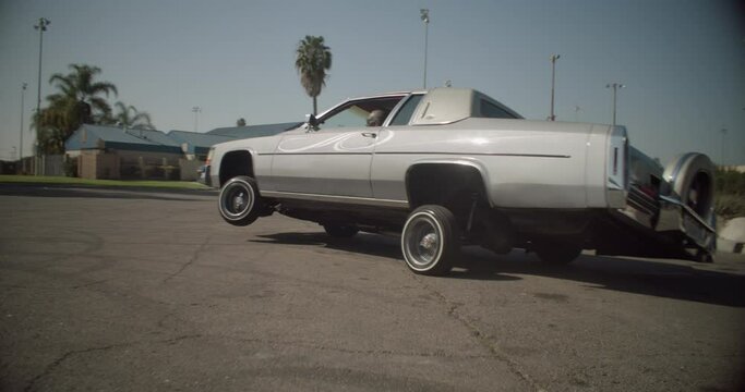 Grey Lowrider Driving On 3 Wheels in Compton California Slow Motion Shot On RED Camera