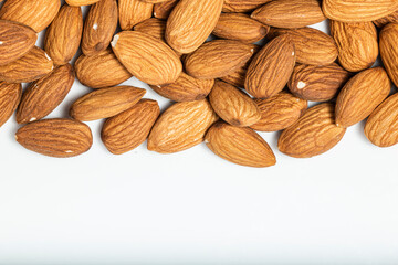 Almonds isolated on white background. Top view. Macro photography.