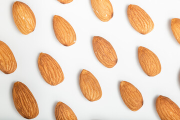 Almonds flat lay pattern. White background. Top view.