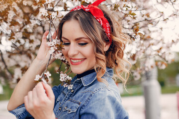 Fototapeta premium Elegant and stylish girl in a spring park