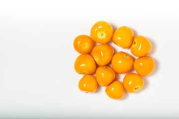Bunch of bright yellow ripe Cape goldenberries isolated on white background. Top view. White background.